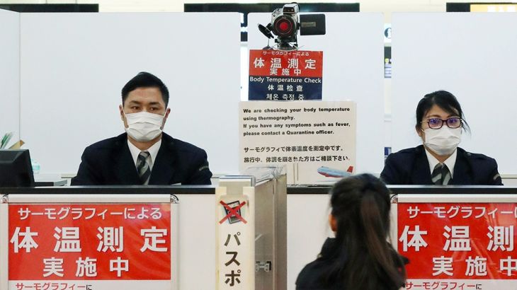 A passenger walks past a quarantine control station at Narita airport in Narita, Japan, 16 January 2020 (issued 19 January 2020). According to latest media reports, more than 60 people are infected wi