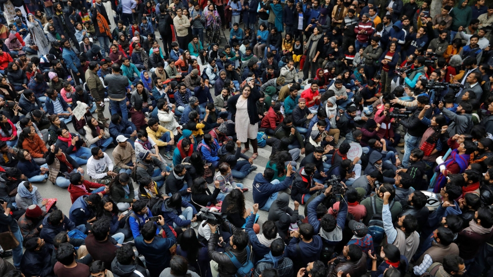 Demonstrators attend a protest against the attacks on students of Jawaharlal Nehru University (JNU) on Sunday, on the university campus in New Delhi