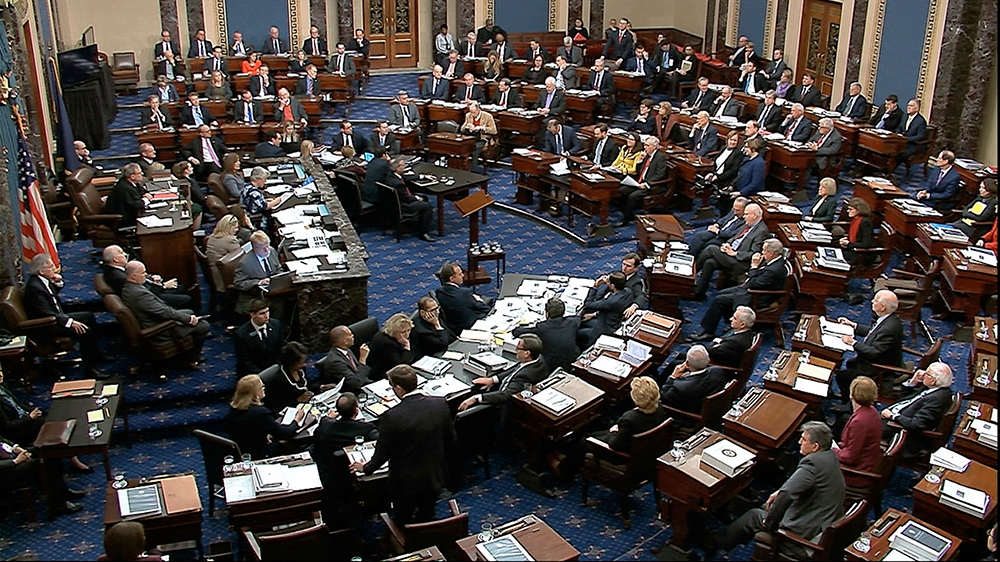 In this image from video, Senators vote on approving the rules for the impeachment trial against President Donald Trump in the Senate at the U.S. Capitol in Washington, Wednesday, Jan. 22, 2020. Senat