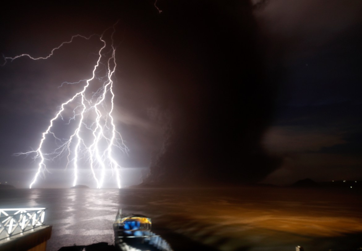 A view of a lightning strike over Taal Volcano during an eruption, in Talisay, Batangas, Philippines, 12 January 2020. Thousands of people have been ordered to evacuate as the authorities in the Phili