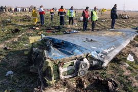 Rescue teams are seen on January 8, 2020 at the scene of a Ukrainian airliner that crashed shortly after take-off near Imam Khomeini airport in the Iranian capital Tehran. - Search-and-rescue teams we