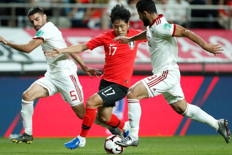 Soccer Football - International Friendly - South Korea v Iran - Seoul World Cup Stadium, Seoul, South Korea - June 11, 2019 South Korea''s Sang-Ho Na in action with Iran''s Hossein Kanaani and