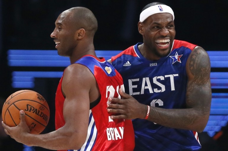 NBA All-Star Kobe Bryant of the Los Angeles Lakers (L) and All-Star LeBron James of the Miami Heat share a laugh during the NBA All-Star basketball game in Houston, Texas, February 17, 2013. REUTERS/L