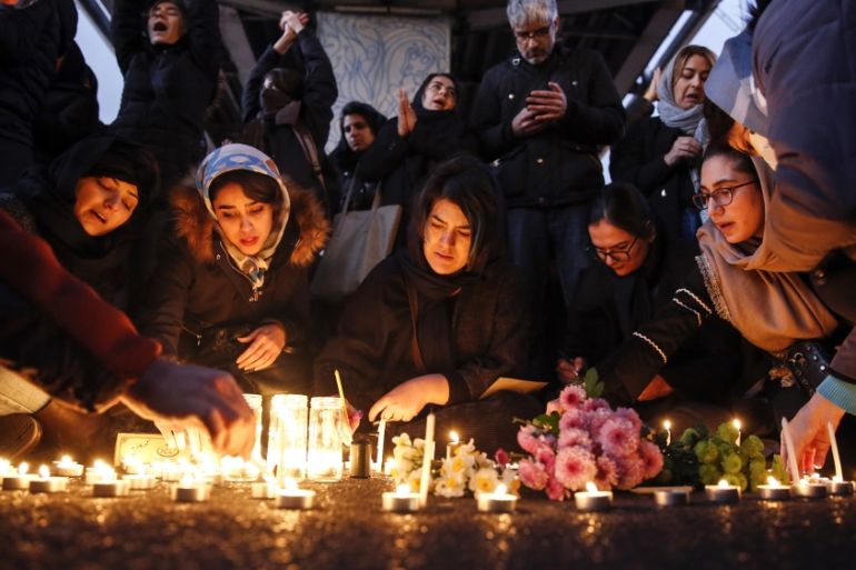 Iranians light candles for victims of Ukraine International Airlines Boeing 737-800 during as they protest in front of the Amir Kabir University in Tehran, Iran, 11 January 2020. Media reported that h