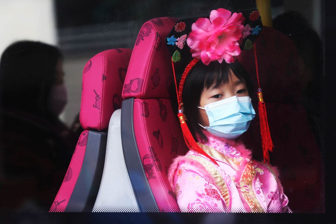 A girl wears a mask inside a bus in Hong Kong, Saturday, Jan. 25, 2020. China''s most festive holiday began in the shadow of a worrying new virus Saturday as the death toll surpassed 40, an unprecedent