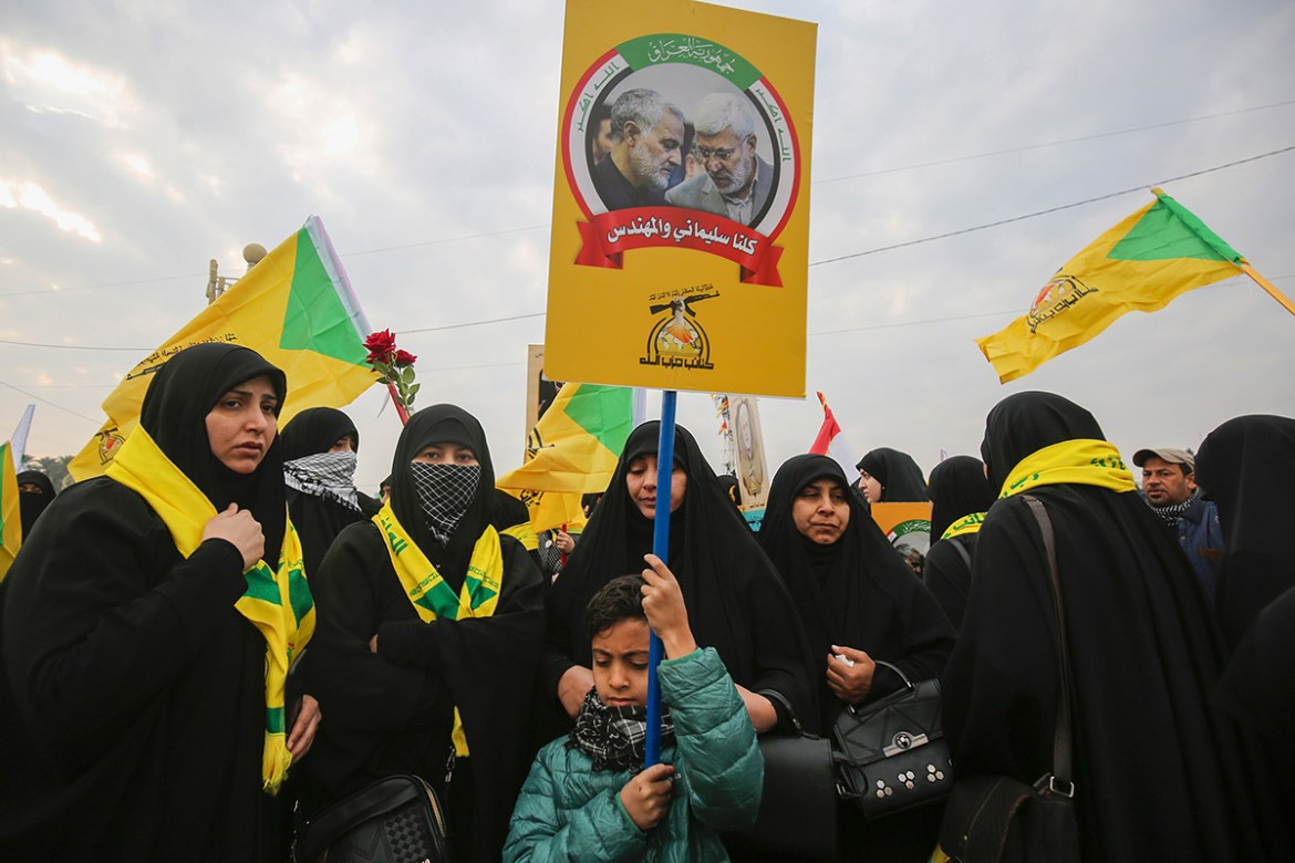 Supporters of the Hashed al-Shaabi paramilitary force and Iraq''s Hezbollah brigades attend the funeral of Iranian military commander Qasem Soleimani (portrait) and Iraqi paramilitary chief Abu Mahdi a
