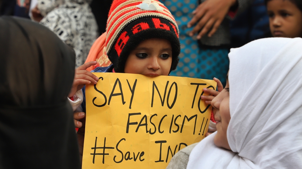 A kid holds a placard during a protest against the citizenship amendment act and NRC in New Delhi India on 01 January 2020 (Photo by Nasir Kachroo/NurPhoto via Getty Images)