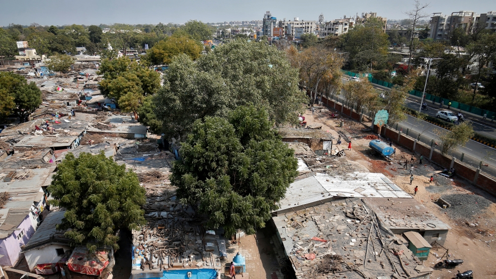 A view of a slum area where a wall was built as part of a beautification drive along a route that US President Trump and India's PM Modi will be taking during Trump's visit later this month, in Ahmeda