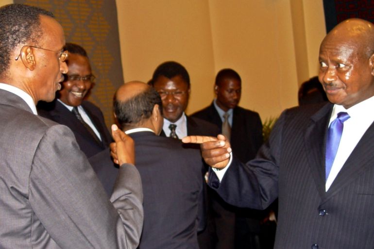 UGANDAN PRESIDENT MUSEVENI JOKES WITH RWANDAN COUNTERPART KAGAME DURING SUMMIT ON BURUNDI IN DAR ES SALAAM. The Chairman of the Great Lakes countries Ugandan President Yoweri Museveni (R) jokes with