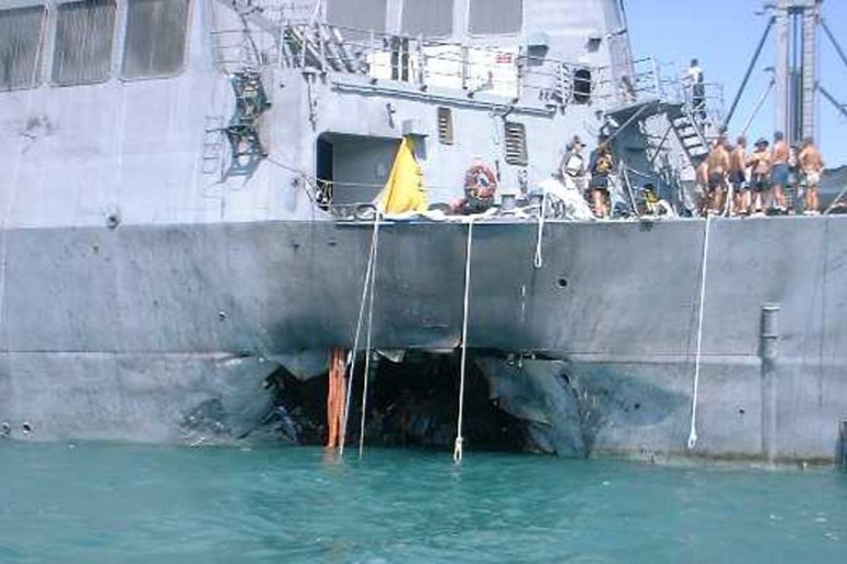 A gaping hole estimated at 40 feet wide and 40 feet high is visible in the left side of the hull of the U.S. warship USS Cole after it was attacked by terrorists in a small boat who maneuvered alongsi