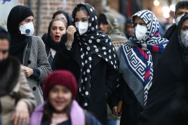 Iranian women wearing protective masks to prevent contracting a coronavirus walk at Grand Bazaar in Tehran, Iran February 20, 2020. WANA (West Asia News Agency)/Nazanin Tabatabaee