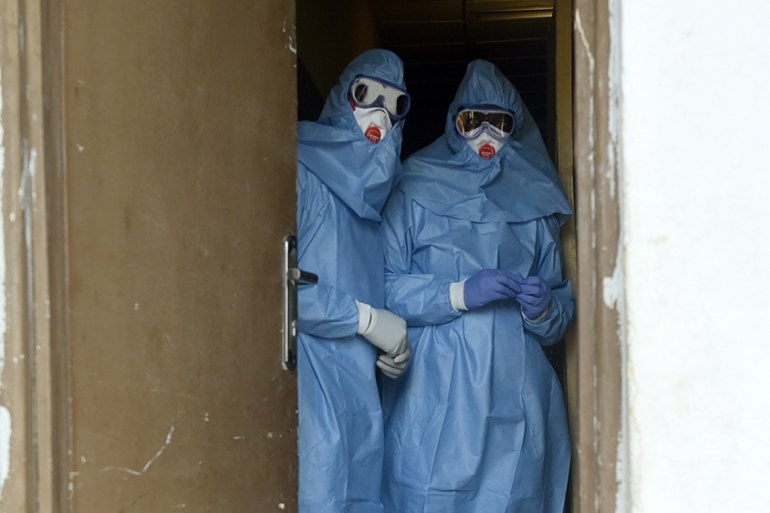 Health officials wear protective gear to tend to Lassa fever patients at the Institute of Lassa Fever Research and Control in Irrua Specialist Teaching Hospital in Irrua, Edo State, midwest Nigeria,