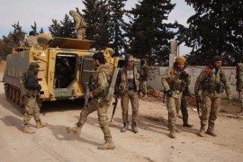 Turkish-backed Syrian fighters gather in the village of al-Mastumah, about seven kilometres south of the city of Idlib on February 10, 2020. The Syrian army took control of a strategic northwestern cr