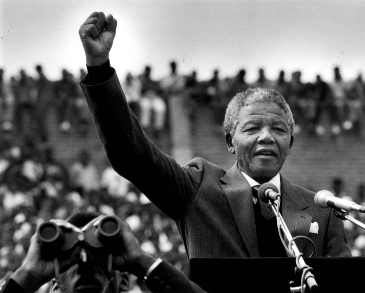 FEBRUARY 13: Nelson Mandela gestured to supporters in Soweto two days after his release from prison in Cape Town. He addressed more than 100,000 people inside a soccer stadium saying, "during the past