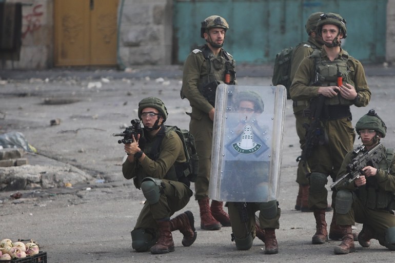 Israeli soldiers deploy during clashes with Palestinians as they protest the Mideast plan announced by the U.S. President Donald Trump, in Hebron, West Bank, Thursday, Jan. 30, 2020. Trump''s Mideast p