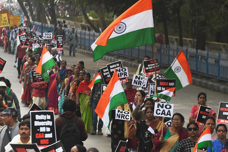 Members of the Christian community along with social activists hold placards and Indian flags as they take part in a rally to protests against the Indian government''s Citizenship Amendment Act (CAA),
