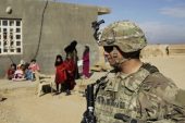 US Army soldiers speak to families in rural Anbar on a reconnaissance patrol near a coalition outpost in western Iraq on January 27, 2018 [File: AP/Susannah George]

 [Daylife]