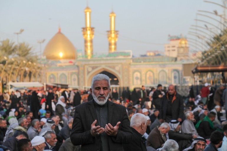 An Iraqi man prays at Imam Abbas shrine in the holy city of Kerbala