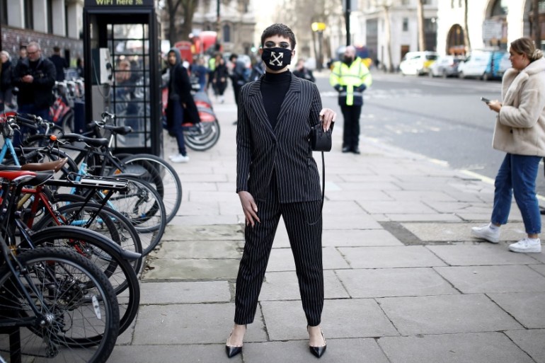 London Fashion Week 2:A man wearing a face mask
