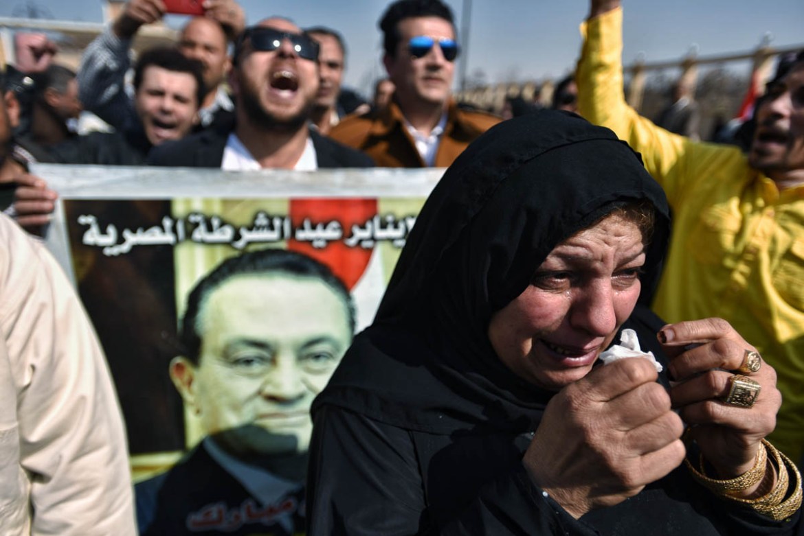 epa08248591 People gather outside Mosheer Tantawy mosque where the funeral of late former Egyptian President Hosni Mubarak will take place, in Cairo, Egypt, 26 February 2020. Mubarak died on 25 Februa