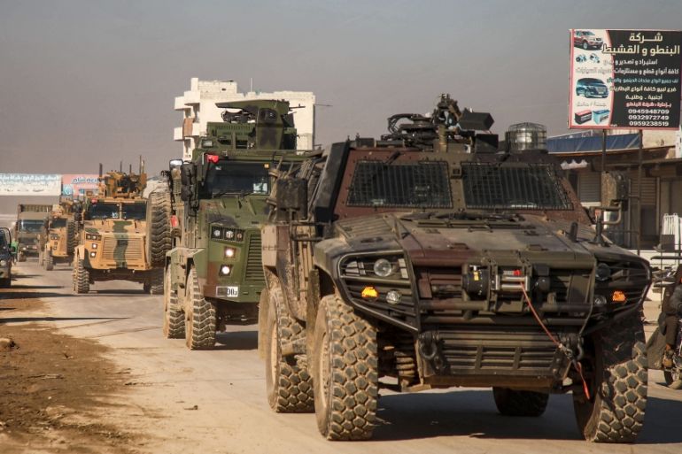 A Turkish military convoy of tanks and armoured vehicles passes through the Syrian town of Dana, east of the Turkish-Syrian border in the northwestern Syrian Idlib province, on February 2, 2020. AARE