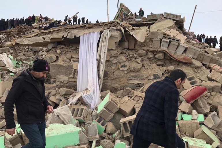 VAN, TURKEY - FEBRUARY 23: Crews and locals conduct search and rescue works at the site of collapsed buildings after a magnitude-5.9 earthquake struck near the border with Iran, in Ozpinar neighbourho
