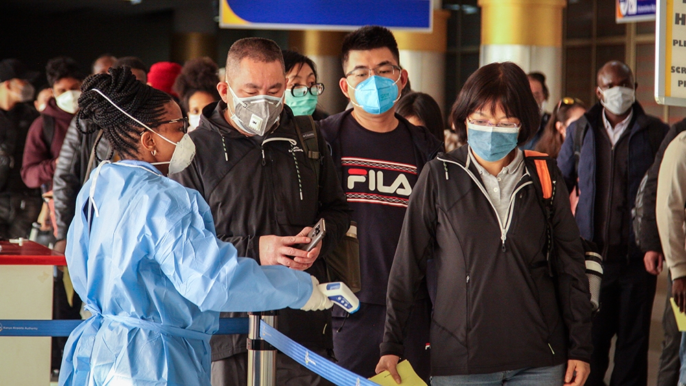 Passengers arriving on a China Southern Airlines flight from Changsha in China are screened for the new type of coronavirus, whose symptoms are similar to the cold or flu and many other illnesses, upo