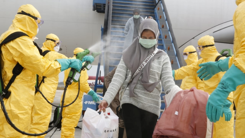 Medical officers prepare evacuated Indonesian nationals from Wuhan, China's center of the coronavirus epidemic, before transferring them to the Natuna Islands military base to be quarantined, at Hang 