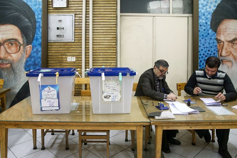 Poll workers are seen during parliamentary elections at a polling station in Tehran, Iran February 21, 2020. Nazanin Tabatabaee/WANA (West Asia News Agency) via REUTERS