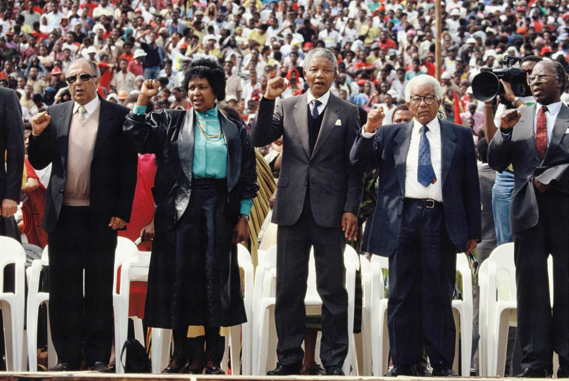 JOHANNESBURG, SOUTH AFRICA - FEBRUARY 13: (L-R) Winnie Mandela, African National Congress (ANC) leader Nelson Mandela and general secretary Walter Sisulu attend a rally in Soweto on February 13, 1990
