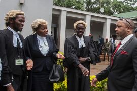 Re-instated Malawi''s Vice President Saulos Klaus Chilima (R) greets lawyers on February 3, 2020, in Lilongwe, prior a to Malawi constitutional court ruling which annulled the results of a May 2019 vot