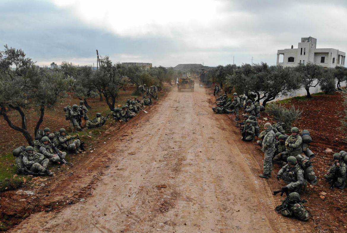 An aerial view shows Turkish soldiers gathering in the village of Qaminas, about 6 kilometres southeast of Idlib city in northwestern Syria on February 10, 2020. - The Syrian army took control of a st
