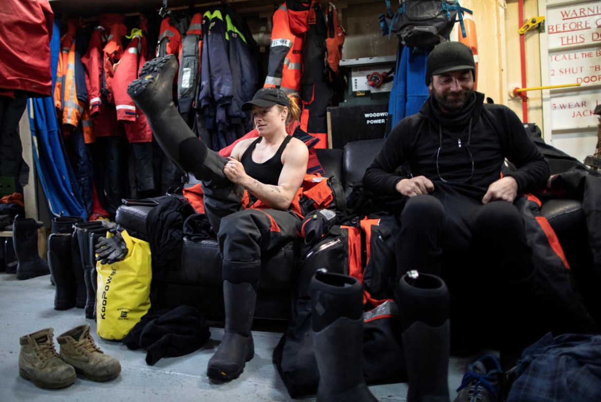 Usnea Granger, a Greenpeace activist, puts on outerwear, aboard the Esperanza ship near Quentin Point, Anvers Island, Antarctica, February 4, 2020. REUTERS/Ueslei Marcelino SEARCH "ANTARCTICA PENG