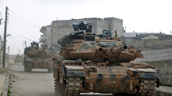A convoy of Turkish M-60T tanks patrols in the town of Atareb in the rebel-held western countryside of Syria''s Aleppo province on February 19, 2020. - Turkey and Russia were engaged in a fresh war of