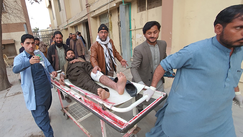 epa08223851 A man who was injured in a bomb blast is shifted to a hospital in Quetta, Pakistan, 17 February 2020. According to reports, at least 10 people were killed and more than 30 injured when a b