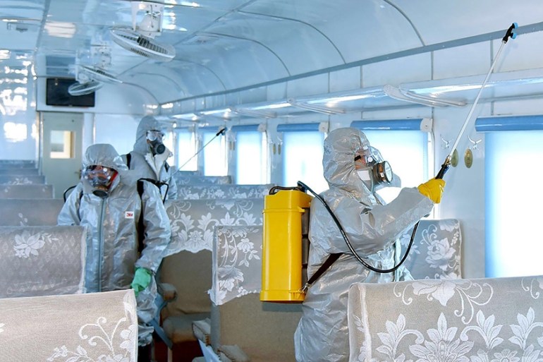This undated picture released from North Korea''s official Korean Central News Agency (KCNA) on February 15, 2020 shows people in protective suits spraying disinfectant at an undisclosed location in No