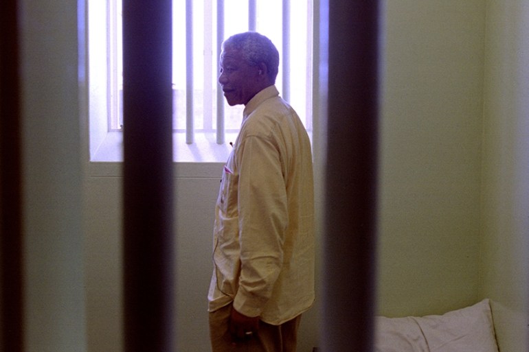 African National Congress ( ANC ) president Nelson Mandela in the prison cell he occupied on Robben Island for much of his 27 year incarceration, February 11th. Mandela''s visit to the island, about 5