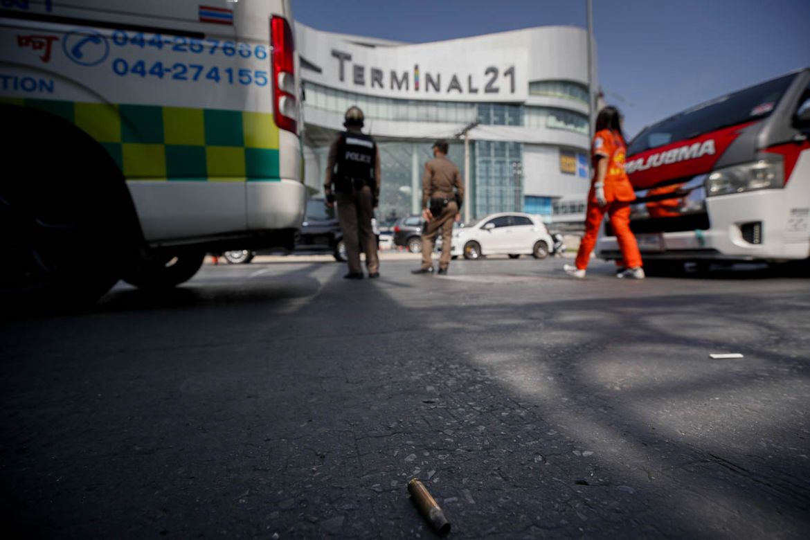 epa08204502 A bullet shell is seen on the street at the scene of a mass shooting at the Terminal 21 shopping mall in Nakhon Ratchasima, Thailand, 09 February 2020. According to media reports, at least