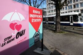 FILE PHOTO: A poster in favour of the change of the penal code is pictured ahead of a referendum on anti-homophobia law in Geneva