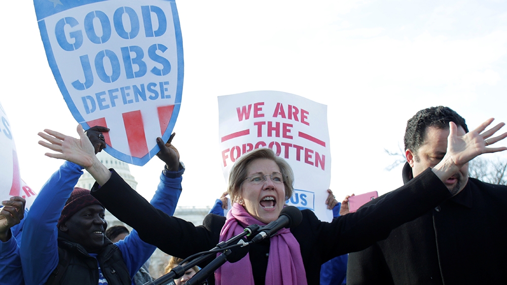 Senator Elizabeth Warren (D-MA) speaks at a federal contract workers rally to celebrate Andrew Puzder's decision to withdraw from consideration to be secretary of labor, on Capitol Hill in Washington,