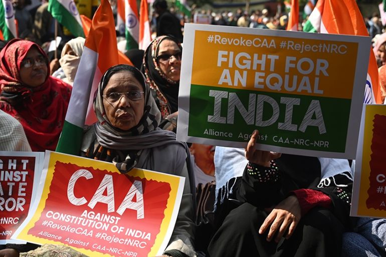 Protesters from Shaheen Bagh hold placards as they take part in a demonstration against India''s new citizenship law at Jantar Mantar, in New Delhi on January, 29, 2020. (Photo by Sajjad HUSSAIN / AFP)