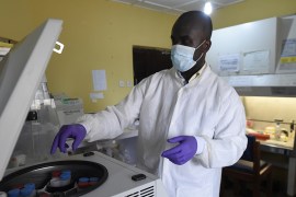 A health official works in the laboratory extraction room of the Institute of Lassa Fever Research and Control in Irrua Specialist Teaching Hospital in Irrua, Edo State, midwest Nigeria, on March 6, 2