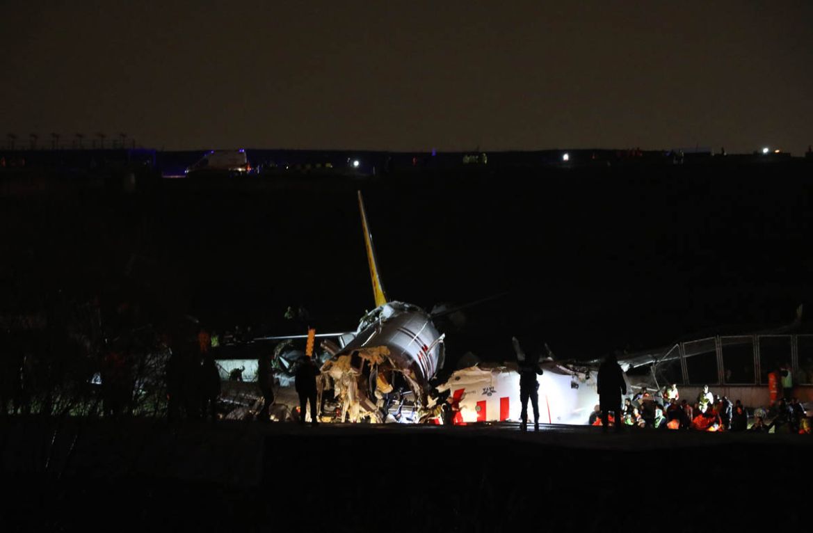 Rescue members work after a plane skidded off the runway at Istanbul''s Sabiha Gokcen Airport, Wednesday, Feb. 5, 2020. A plane skidded off the runway Wednesday at Istanbul’s Sabiha Gokcen Airport, cra