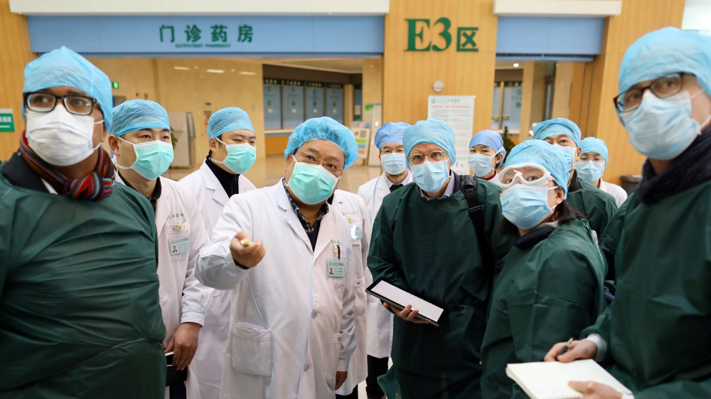Experts from China and the World Health Organization (WHO) joint team wearing face masks visit the Wuhan Tongji Hospital in Wuhan, the epicentre of the novel coronavirus outbreak, in Hubei province, C