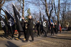 Budapest - marchers with white supremacist celtic cross flags