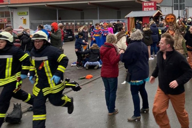 People react at the scene after a car ploughed into a carnival parade injuring several people in Volkmarsen, Germany February 24, 2020. Elmar Schulten/Waldeckische Landeszeitung via REUTERS.