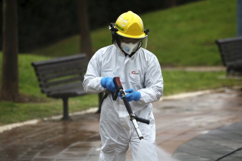 An Israeli firefighter sprays disinfectant as a precaution against the coronavirus in Modi''in, Israel, Tuesday, March 17, 2020. The head of Israel''s shadowy Shin Bet internal security service said Tue