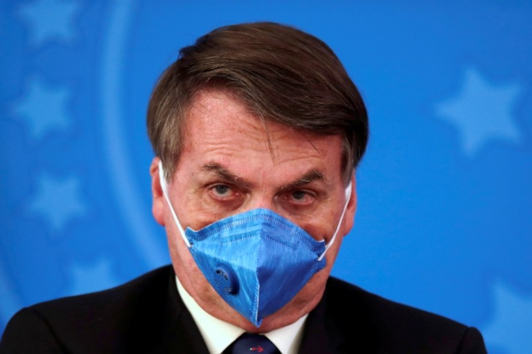 Brazil''s President Jair Bolsonaro is pictured with his protective face mask at a press statement during the coronavirus disease (COVID-19) outbreak in Brasilia