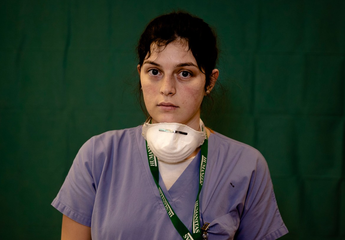 Lucia Perolari, 24, a nurse at the Humanitas Gavazzeni Hospital in Bergamo, Italy poses for a portrait at the end of her shift Friday, March 27, 2020. The intensive care doctors and nurses on the fron