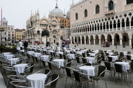 Empty tables are pictured outside a restaurant at St Mark''s Square, which is usually full of tourists, after Italy''s government adopted a decree with emergency new measures t